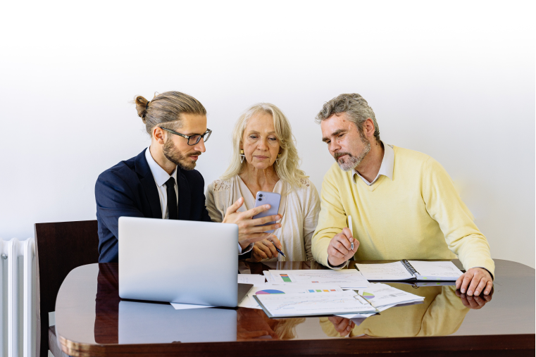 elderly couple getting advice from their advisor