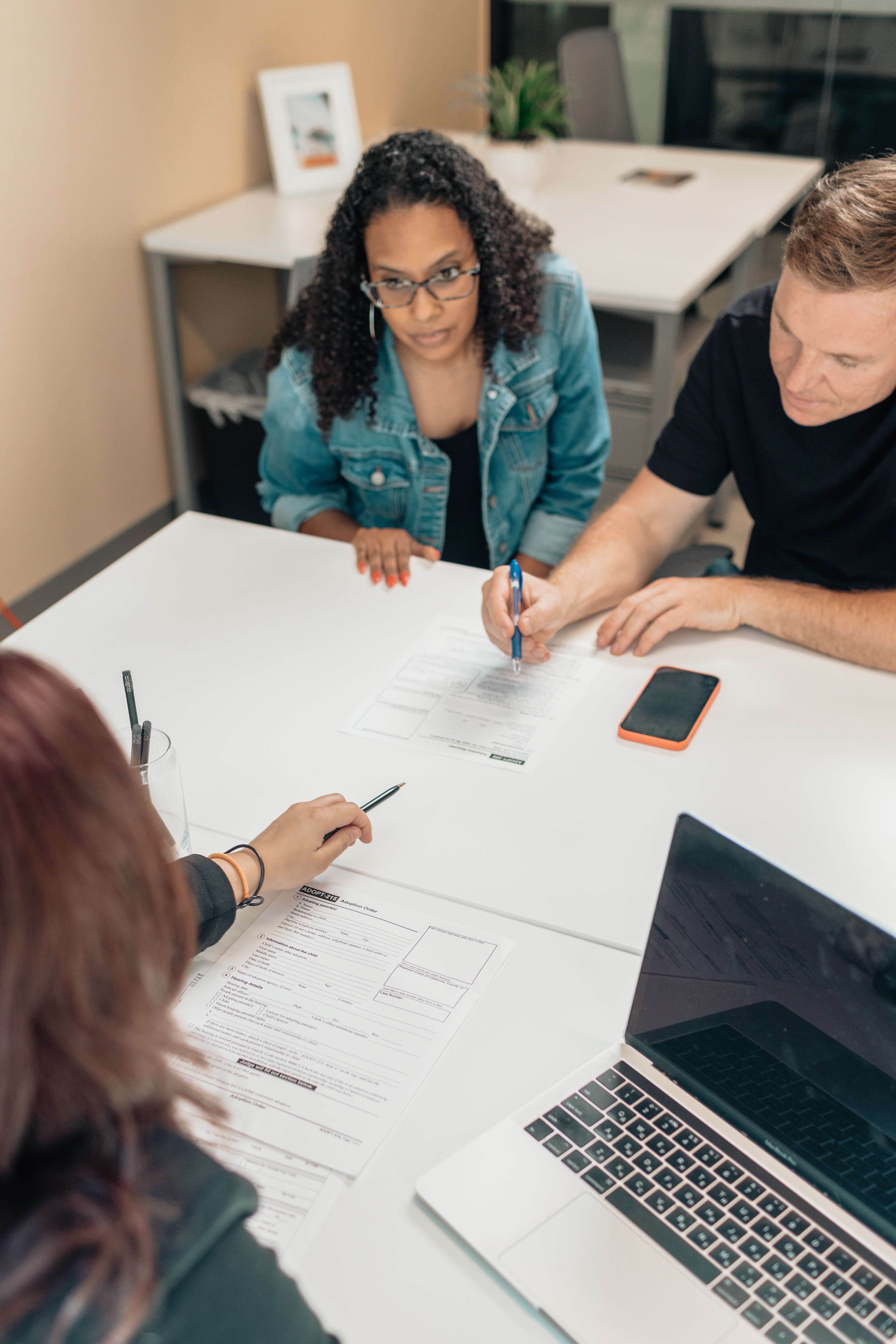 three team members working together