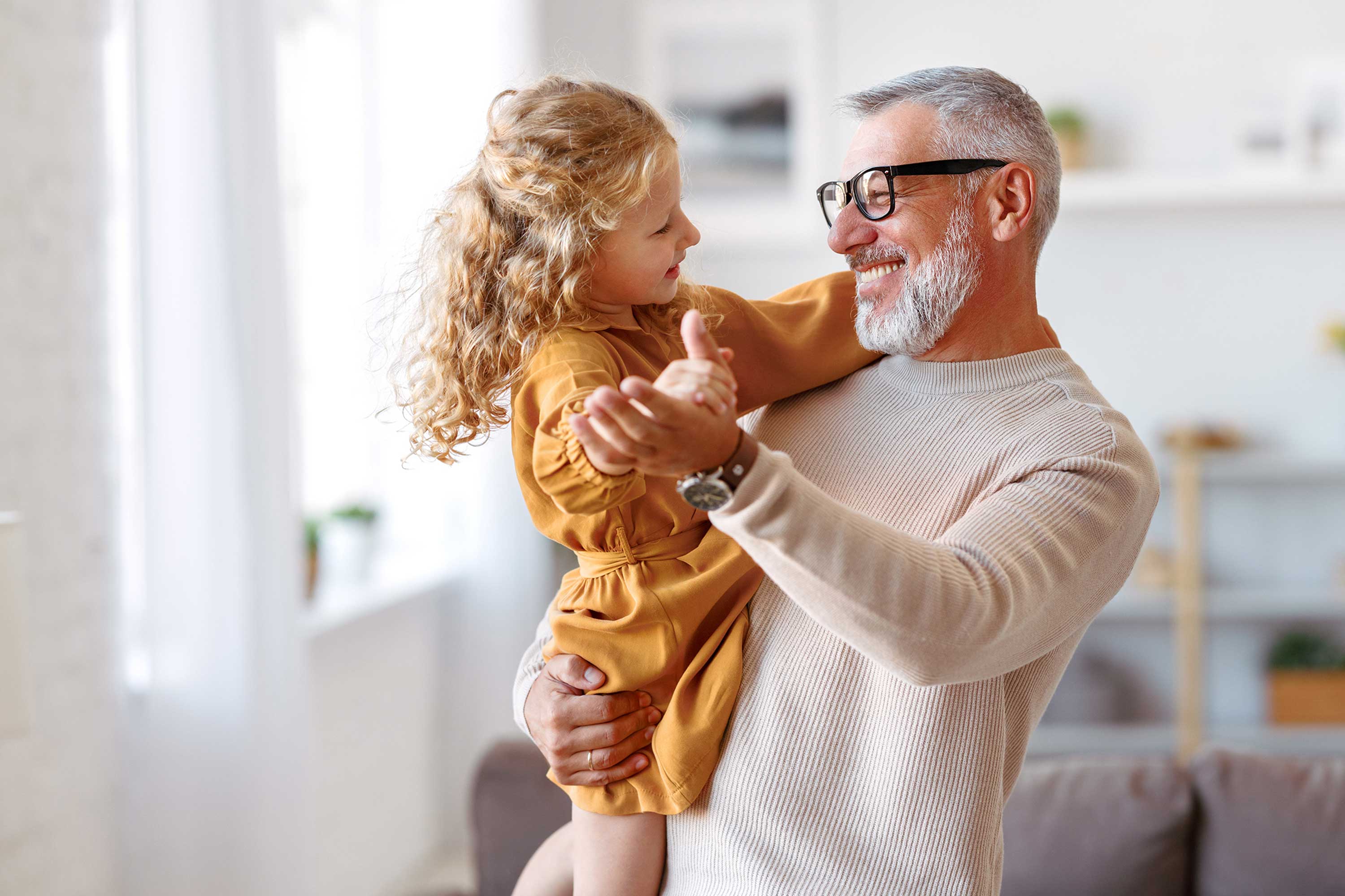 man playing with little girl