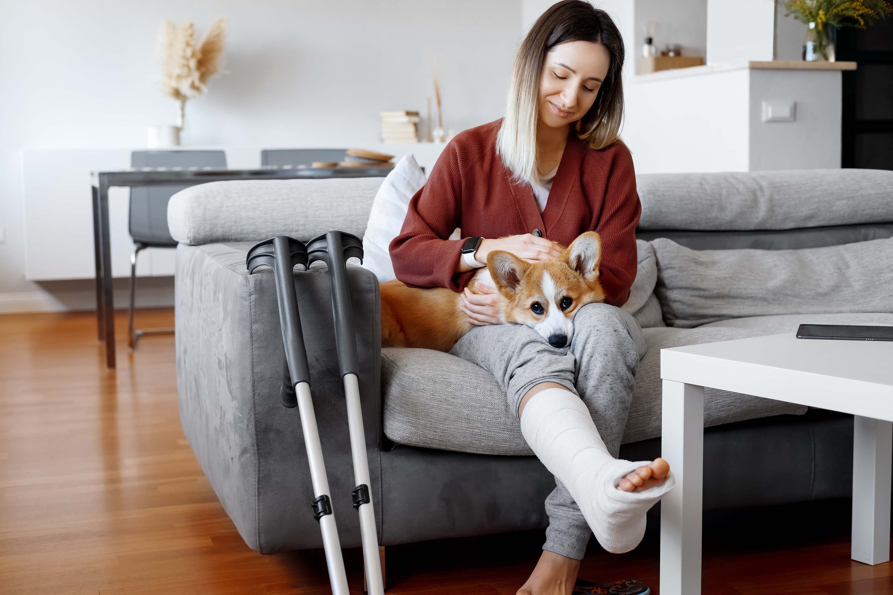 sprain ankle woman holding the dog