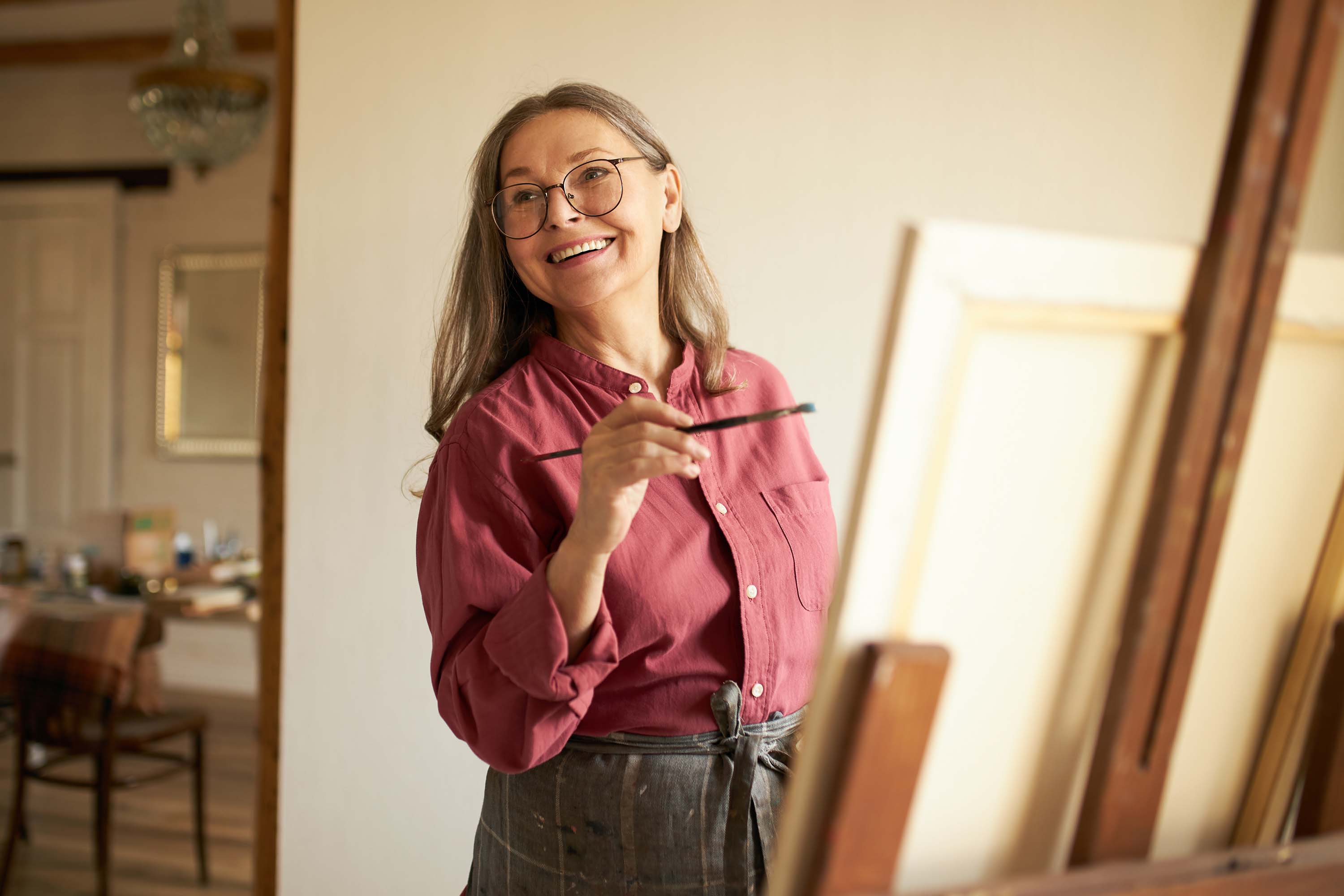 A woman drawing the picture on the board