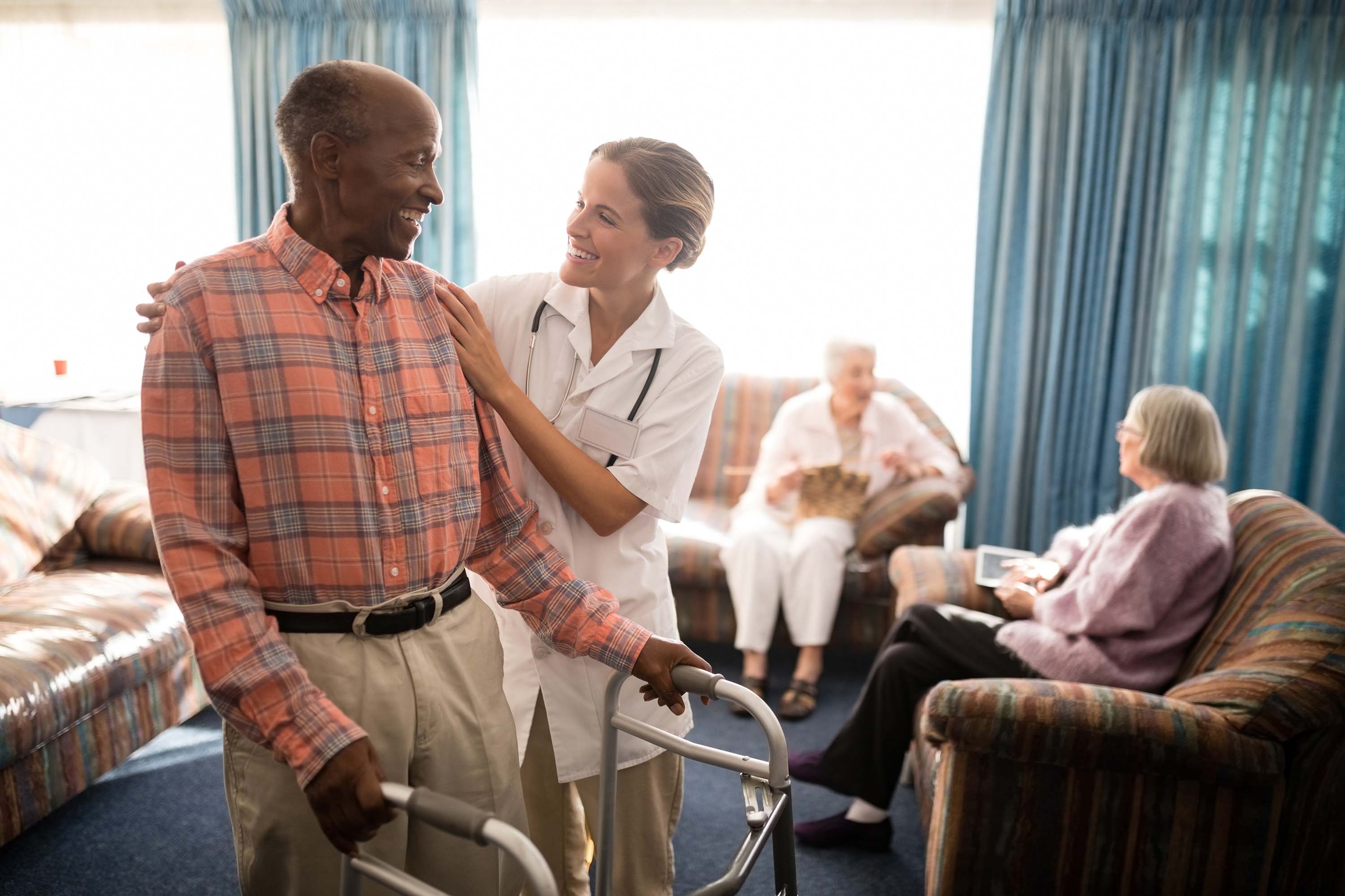 Doctor helping the old man